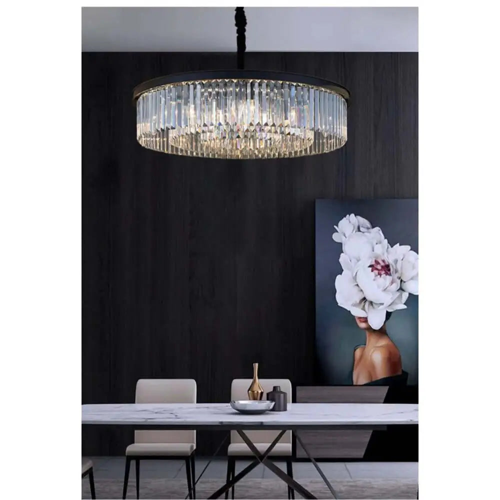 Modern black crystal chandelier hanging above dining table in elegant room.