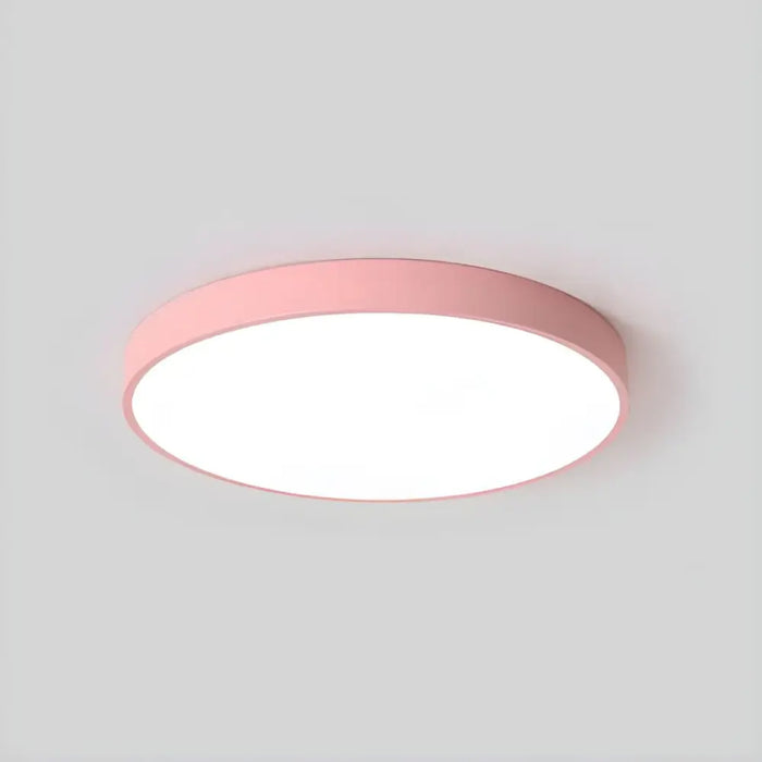 Pink 36 W LED flush mount ceiling light with colour changing via wall switch, featuring frosted diffuser.
