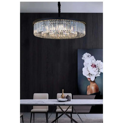 Modern black crystal chandelier hanging above dining table in elegant room.